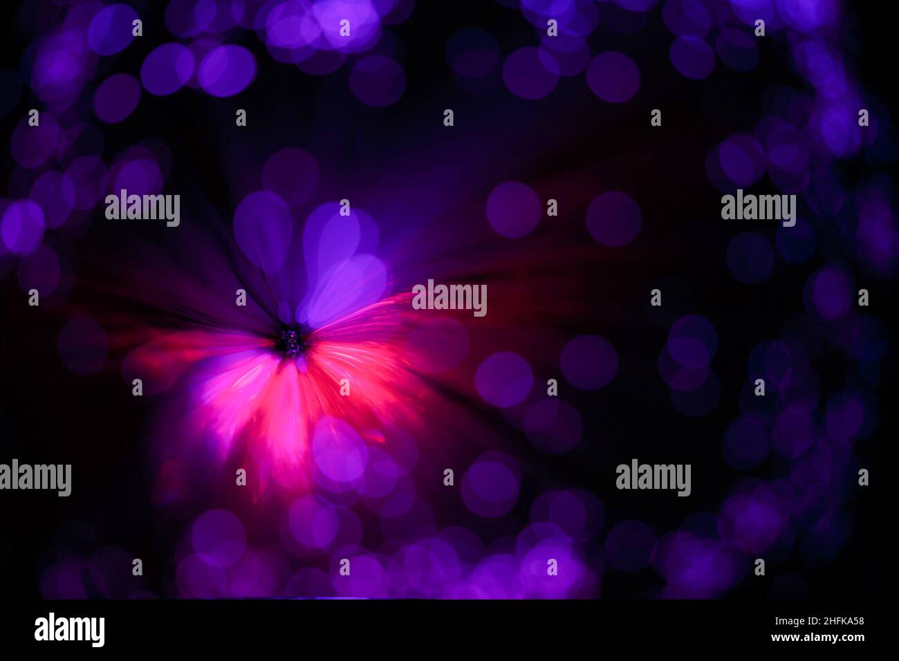 Abstract purple background in the form of a flower and blurred spots. Stock Photo