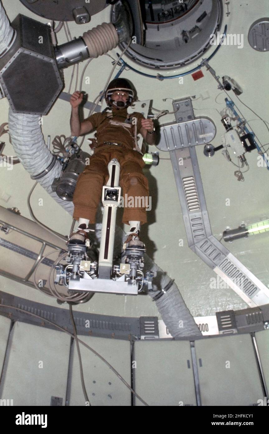(July-September 1973) --- Astronaut Alan L. Bean, Skylab 3 commander, flies the M509 Astronaut Maneuvering Equipment in the forward dome area of the Orbital Workshop (OWS) on the space station cluster in Earth orbit. Bean is strapped in to the back-mounted, hand-controlled Automatically Stabilized Maneuvering Unit (ASMU). This ASMU experiment is being done in shirt sleeves. The dome area where the experiment is conducted is about 22 feet in diameter and 19 feet from top to bottom Stock Photo