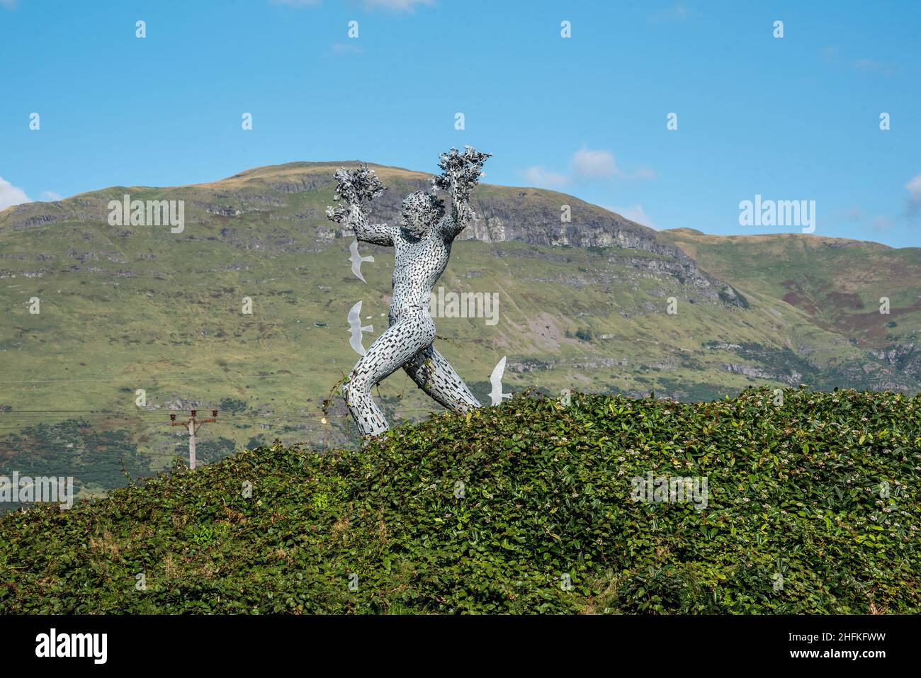 'Air Spirit' striding man sculpture by Andy Scott at Tullibody Bypass, Clackmannanshire, Scotland. Stock Photo