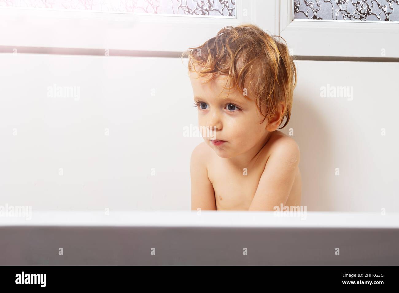 Handsome little boy portrait sit in the bath Stock Photo Alamy