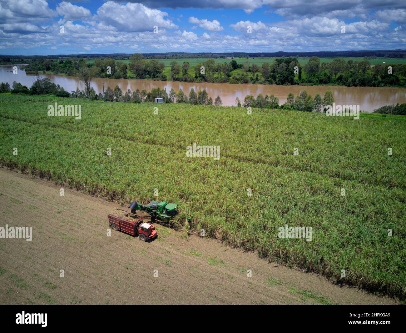 Aerial of sugar cane harvesting on the banks of the Burnett River Wallaville Queensland Australia Stock Photo