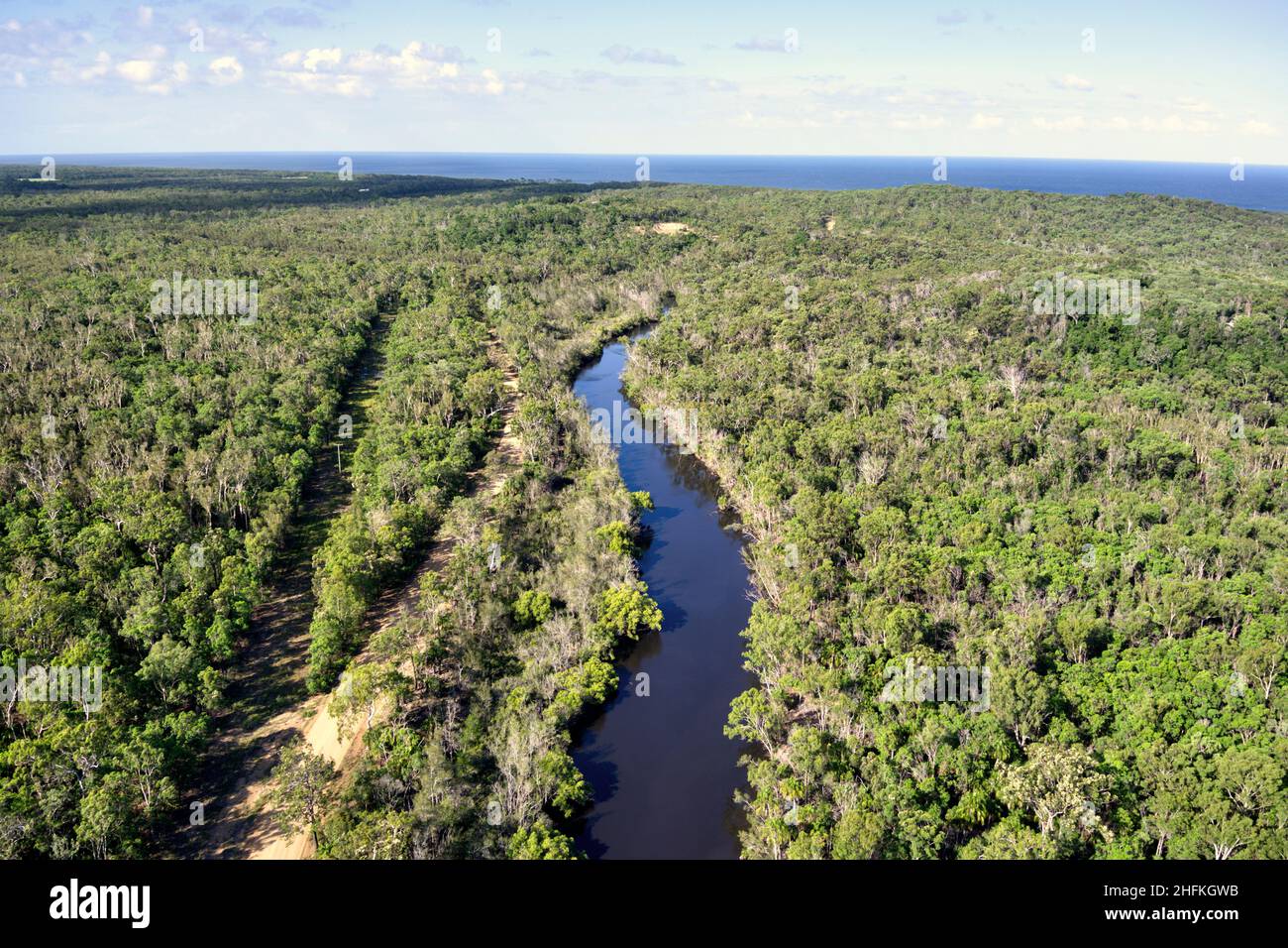 Aerial of Deepwater Creek as it flows to the ocean Queensland Australia