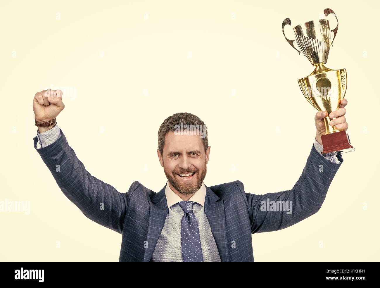 successful businessman man in suit hold champion cup s business reward isolated on white, victory Stock Photo