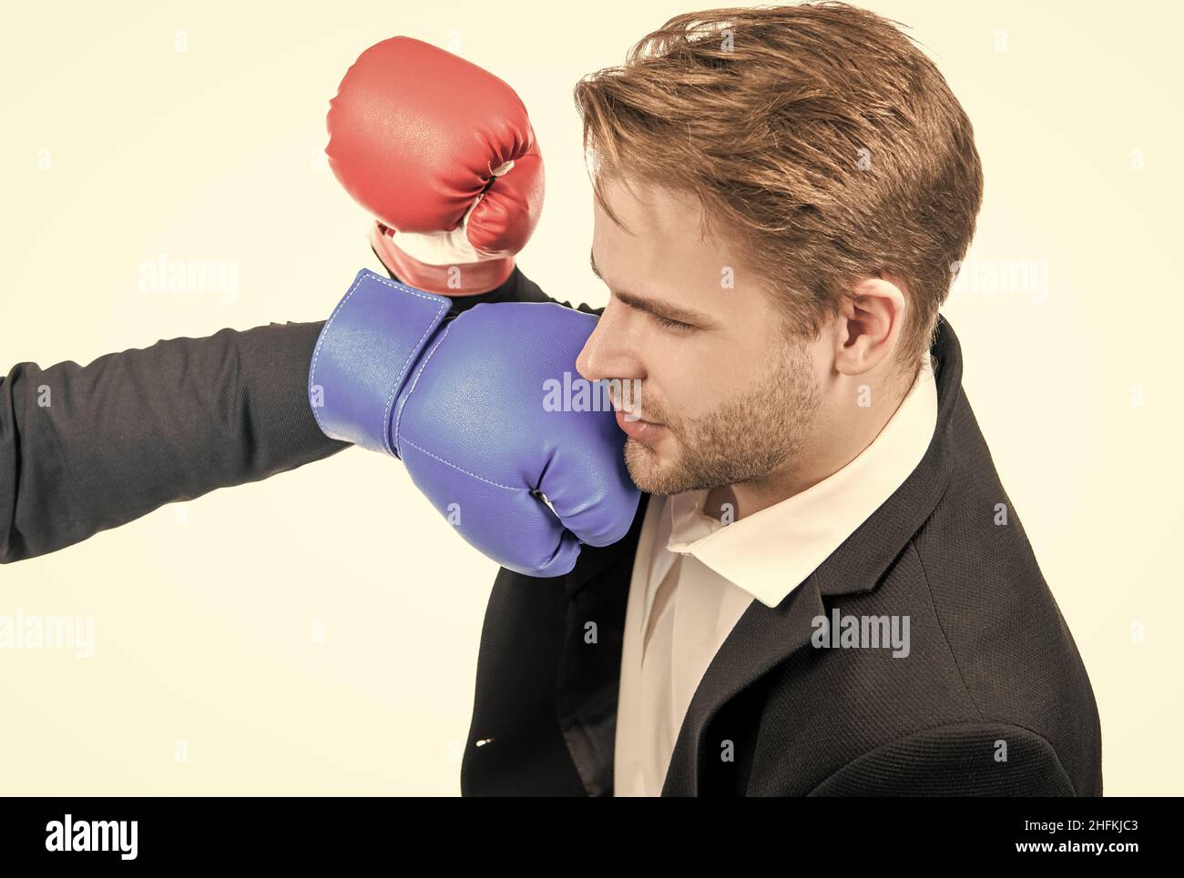 Young professional business man get punched in face with boxing glove  isolated on white, looser Stock Photo - Alamy