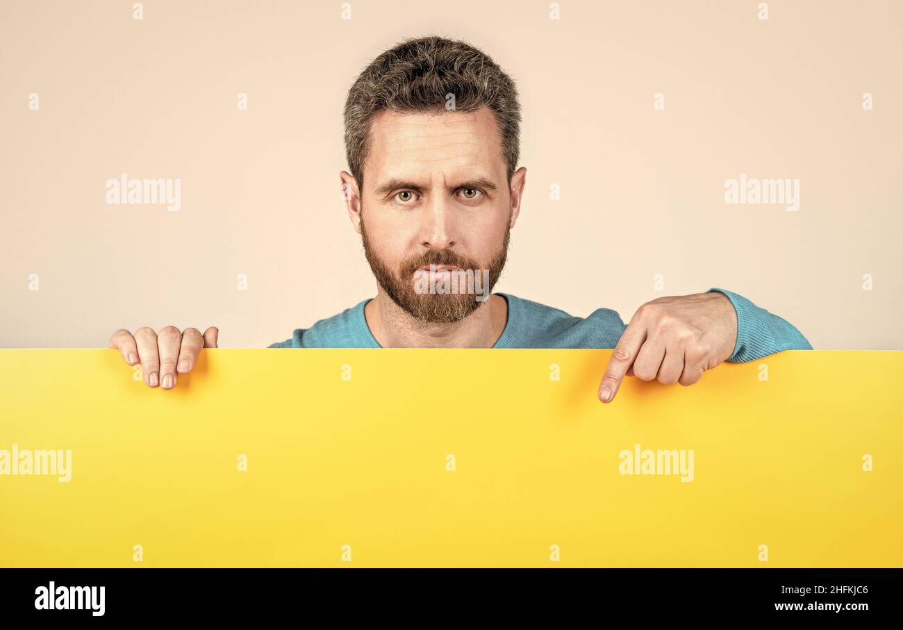 for your marketing design. bearded man with paper banner. guy make announcement Stock Photo Alamy