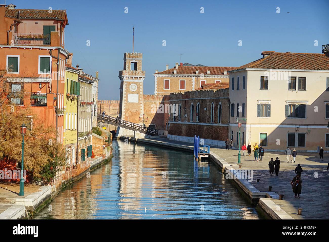 One of the canals in Venice and the Arsenal Tower in the distance.  Venice, Italy - January 2022 Stock Photo