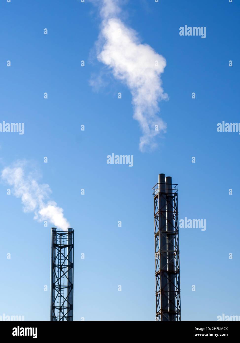 white smoke from the chimney of the chock, against the blue sky Stock ...