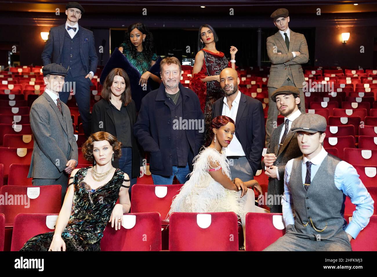 Peaky Blinders creator Steven Knight (C), Artistic Director of Rambert Benoit Swan Pouffer (Centre right) and Chief Executive and Executive Producer of Rambert Helen Shute (Centre left), pose for photographs alongside members of the cast, during the press launch of the Rambert Dance production of Peaky Blinders: The Redemption of Thomas Shelby at the Dance Hub Birmingham. Picture date: Monday January 17, 2022. Stock Photo