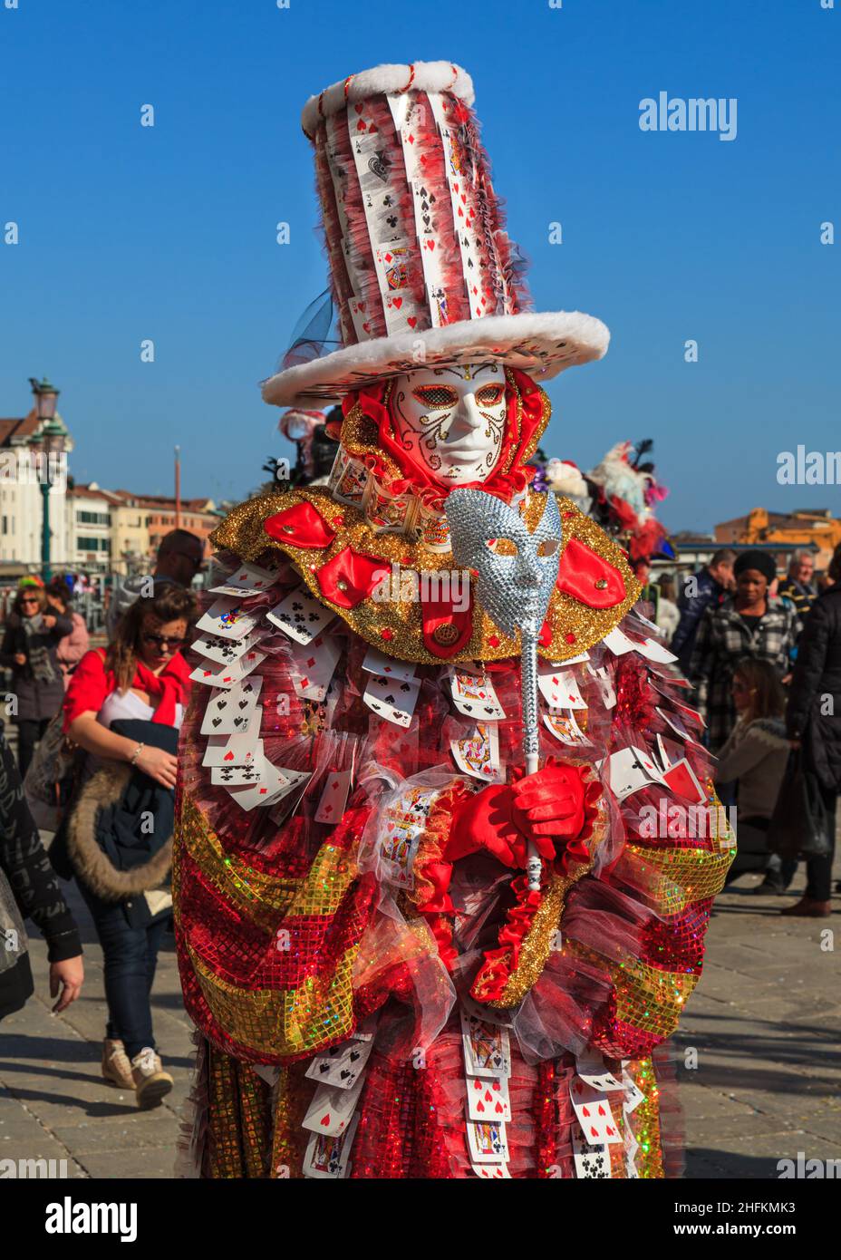 Participant in colourful card game fancy dress costume and mask at Carnevale di Venezia, Venice Carnival, Italy Stock Photo