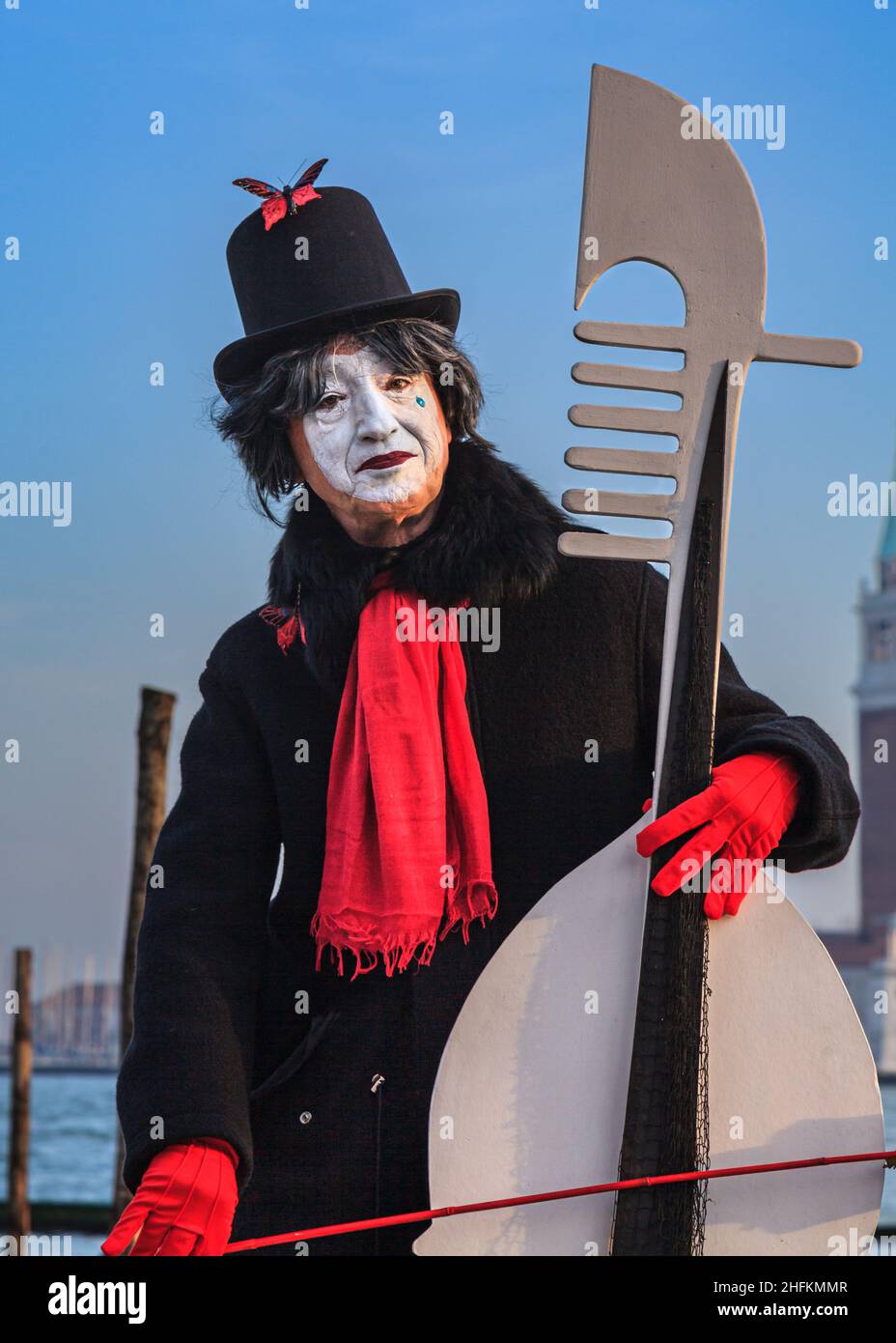 A pierrot or sad clown,  commedia dell'arte character in fancy dress costume at Venice Carnival, Carnivale di Venezia, Italy Stock Photo