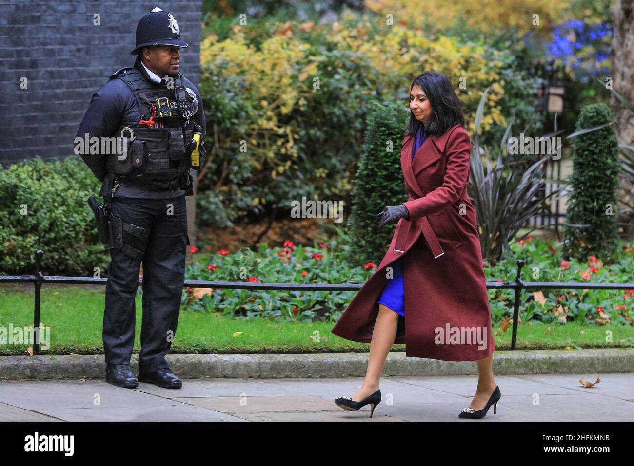 Suella Braverman QC MP, Attorney General, British Conservative Party politician, walks past police officer in Downing Street, London Stock Photo