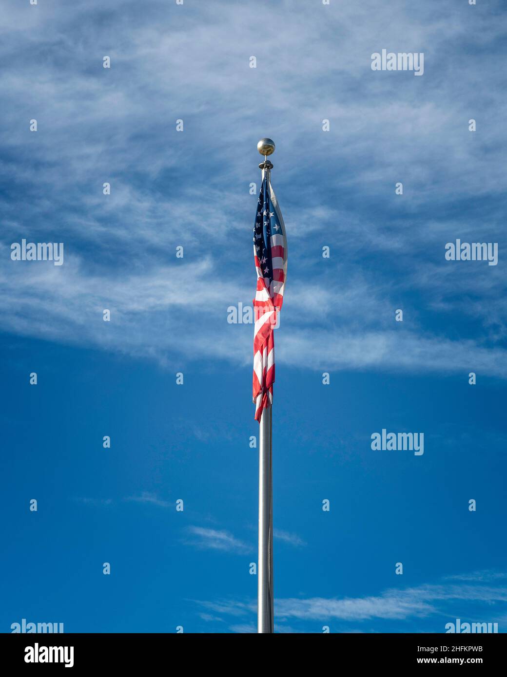 Flag of the United States of America against a blue sky Stock Photo - Alamy