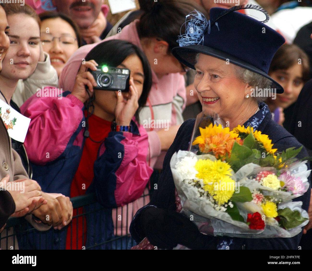 File photo dated 07/10/2002 of Queen Elizabeth II meeting wellwishers during a walkabout at the University of British Columbia in Canada. Members of the public are being asked to submit their own snapshots of the royal family, with the chance to see them exhibited alongside some of the most legendary royal images in history. Issue date: Monday January 17, 2022. Stock Photo
