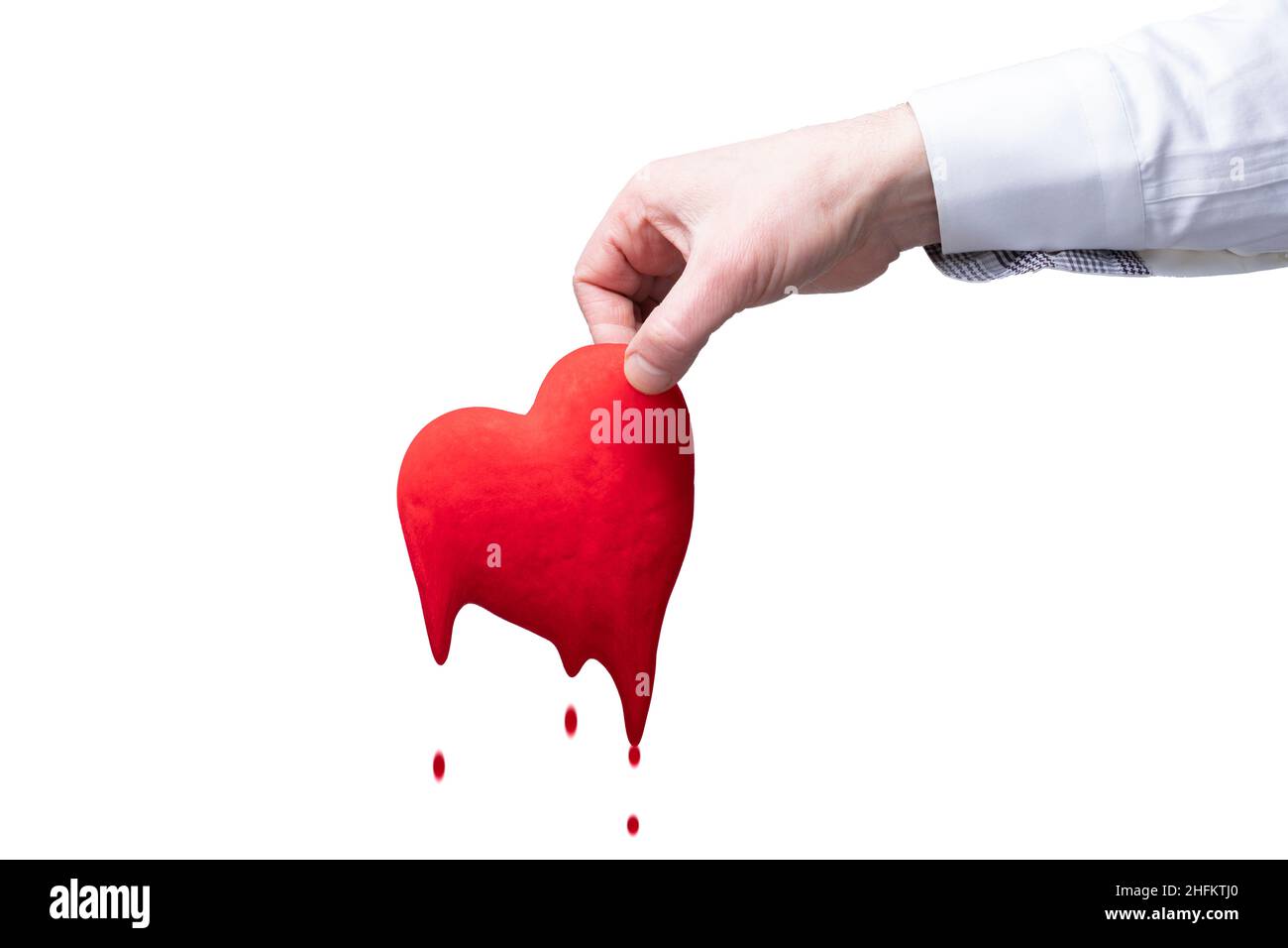 a man's hand holds a red heart on a white isolate background. blood  dripping dripping drops throws out a heart symbol of love. separation or  breakup d Stock Photo - Alamy