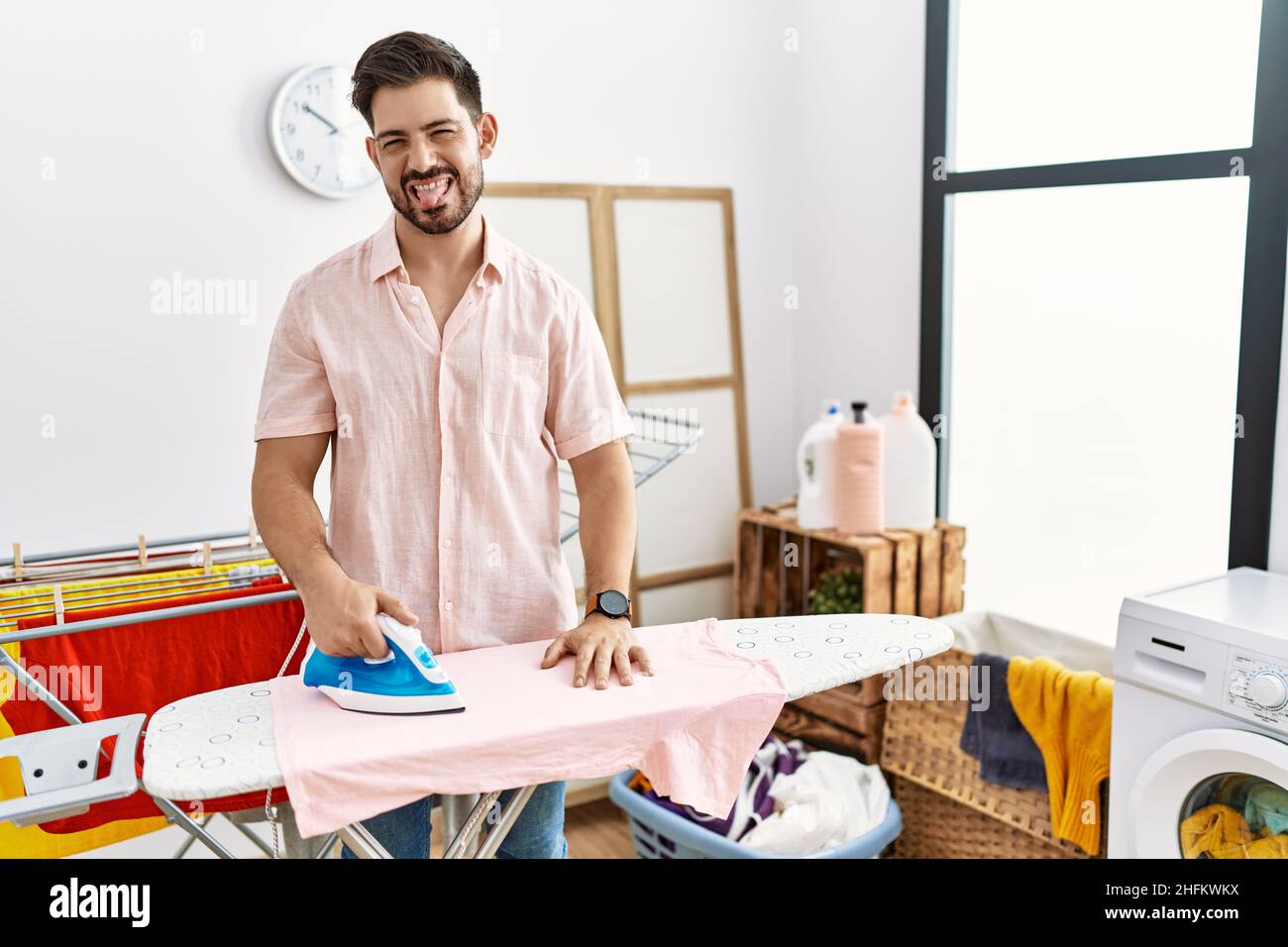 Man ironing clothes hi-res stock photography and images - Alamy