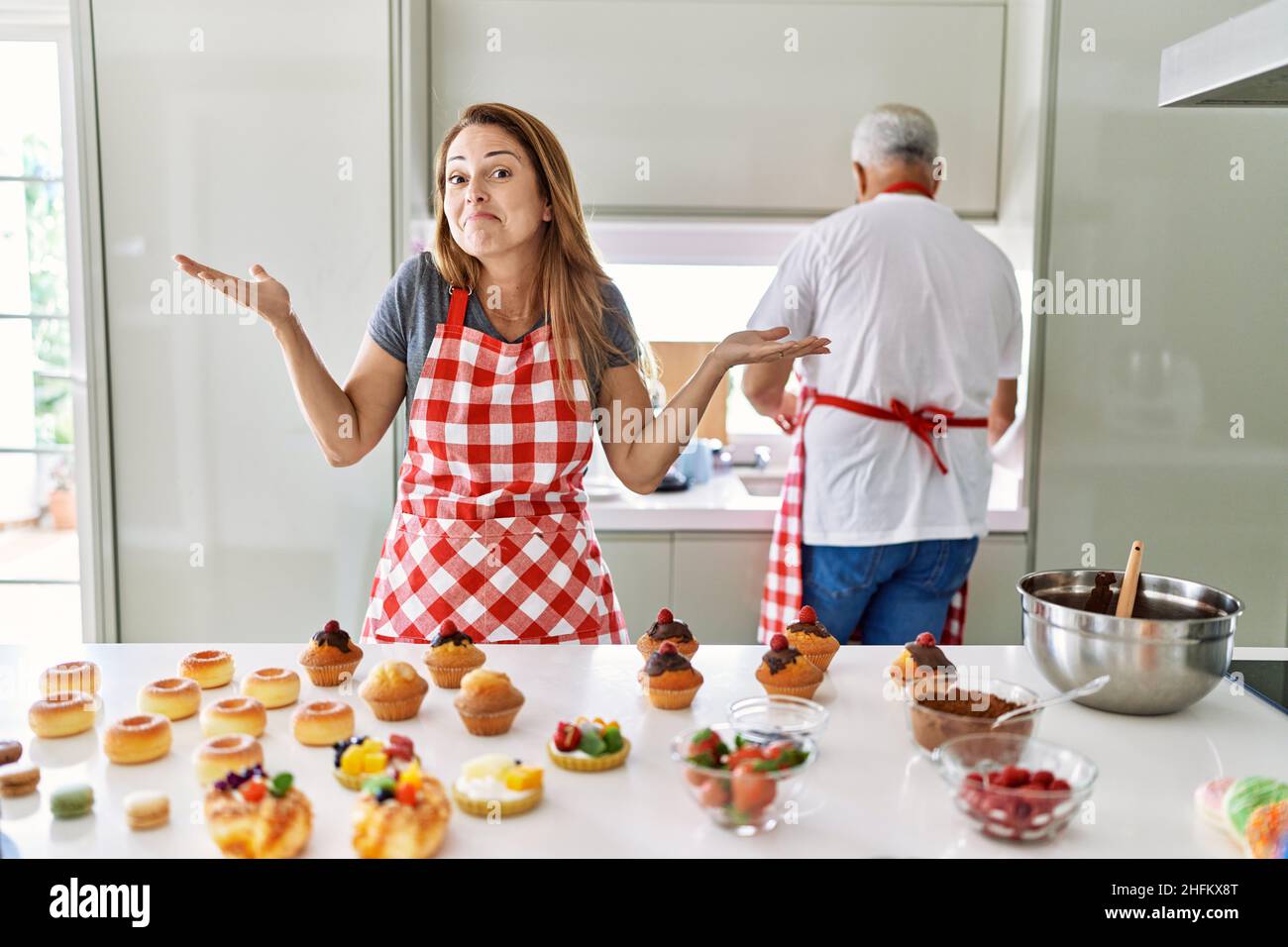 Senior confused woman kitchen hi-res stock photography and images - Alamy