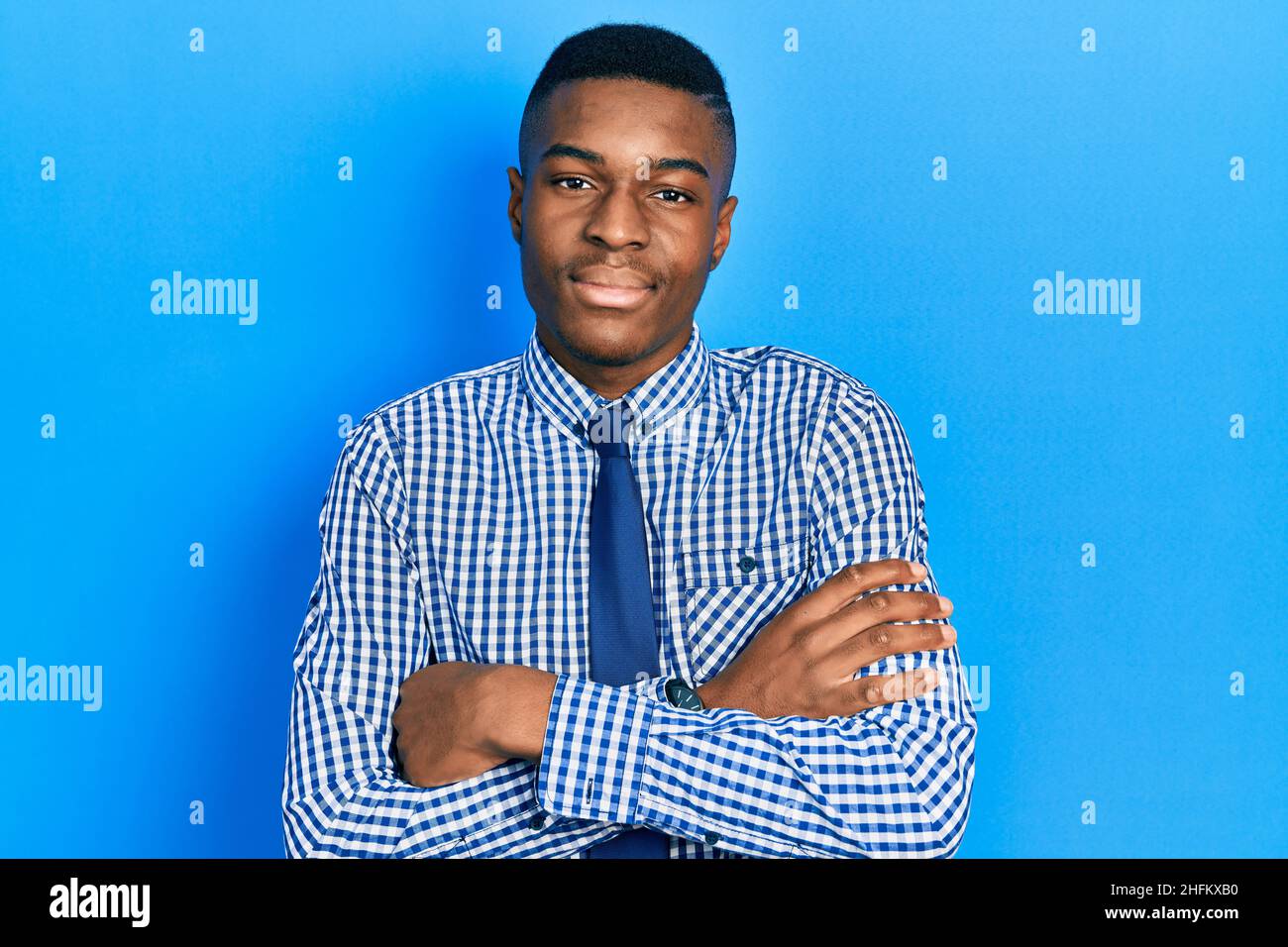Young african american man wearing business shirt and tie happy face ...