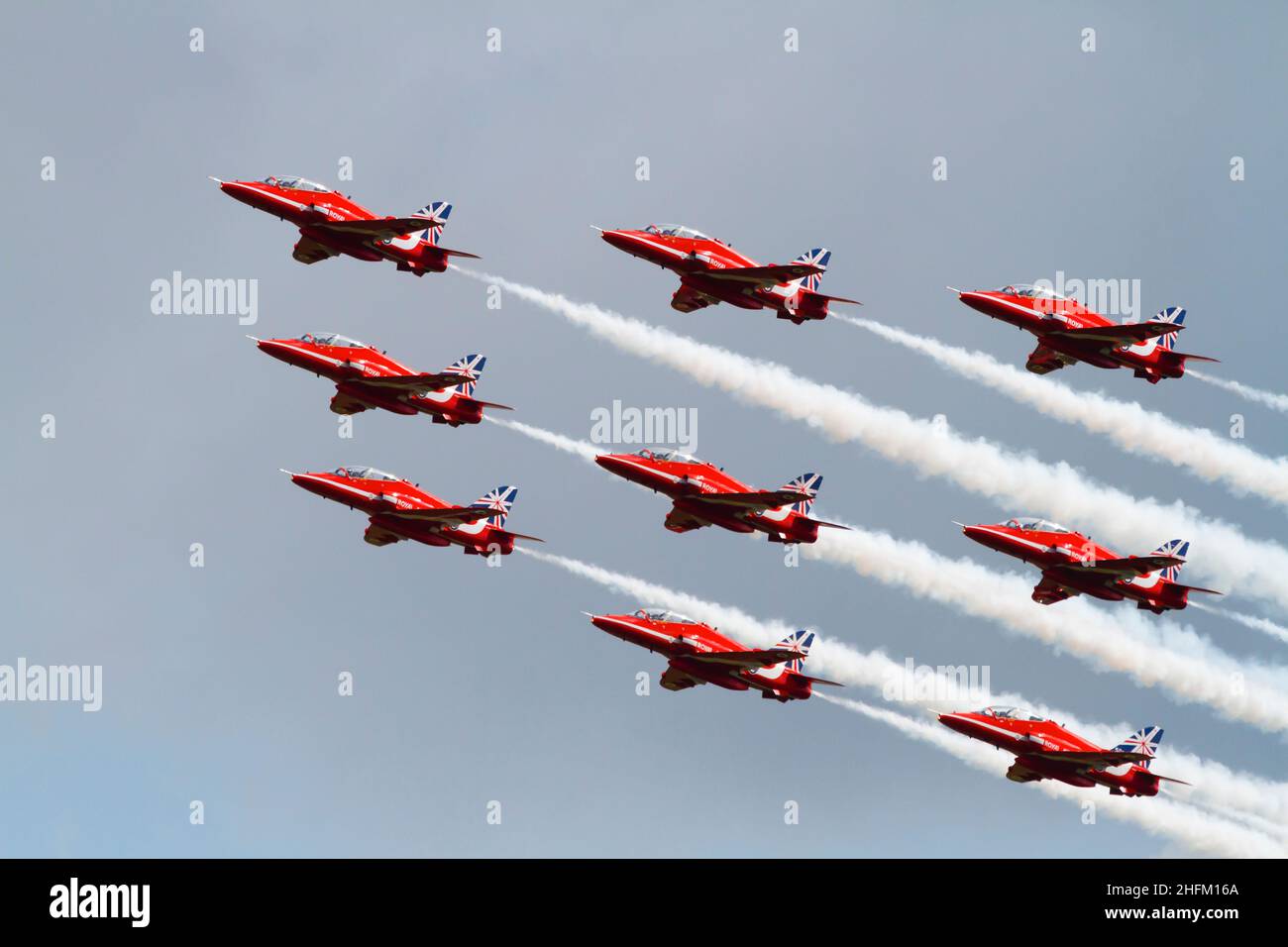 Diamond Nine formation, BAE Hawk T1a aircraft of the Royal Air Force aerobatic display team, The Red Arrows, with the 50th Anniversity tail markings. Stock Photo