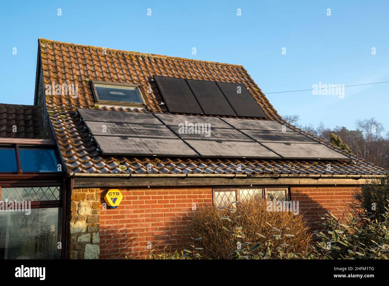 Frost on PV cells showing different sunlight levels at different inclinations to the sun. NB: The premises in the photograph are Property Released. Stock Photo