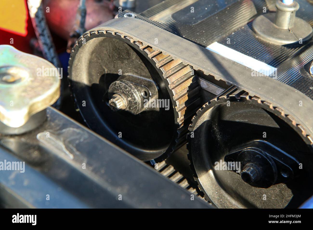 The detail of the historic rallye car. The rubber camshaft belt over