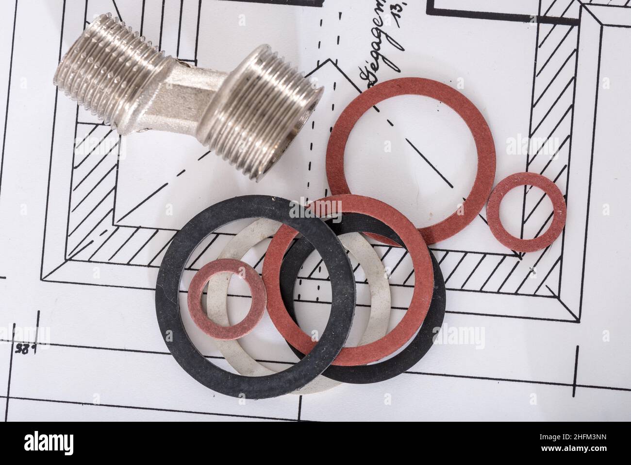 Plumbing fittings and gaskets on a plan Stock Photo Alamy