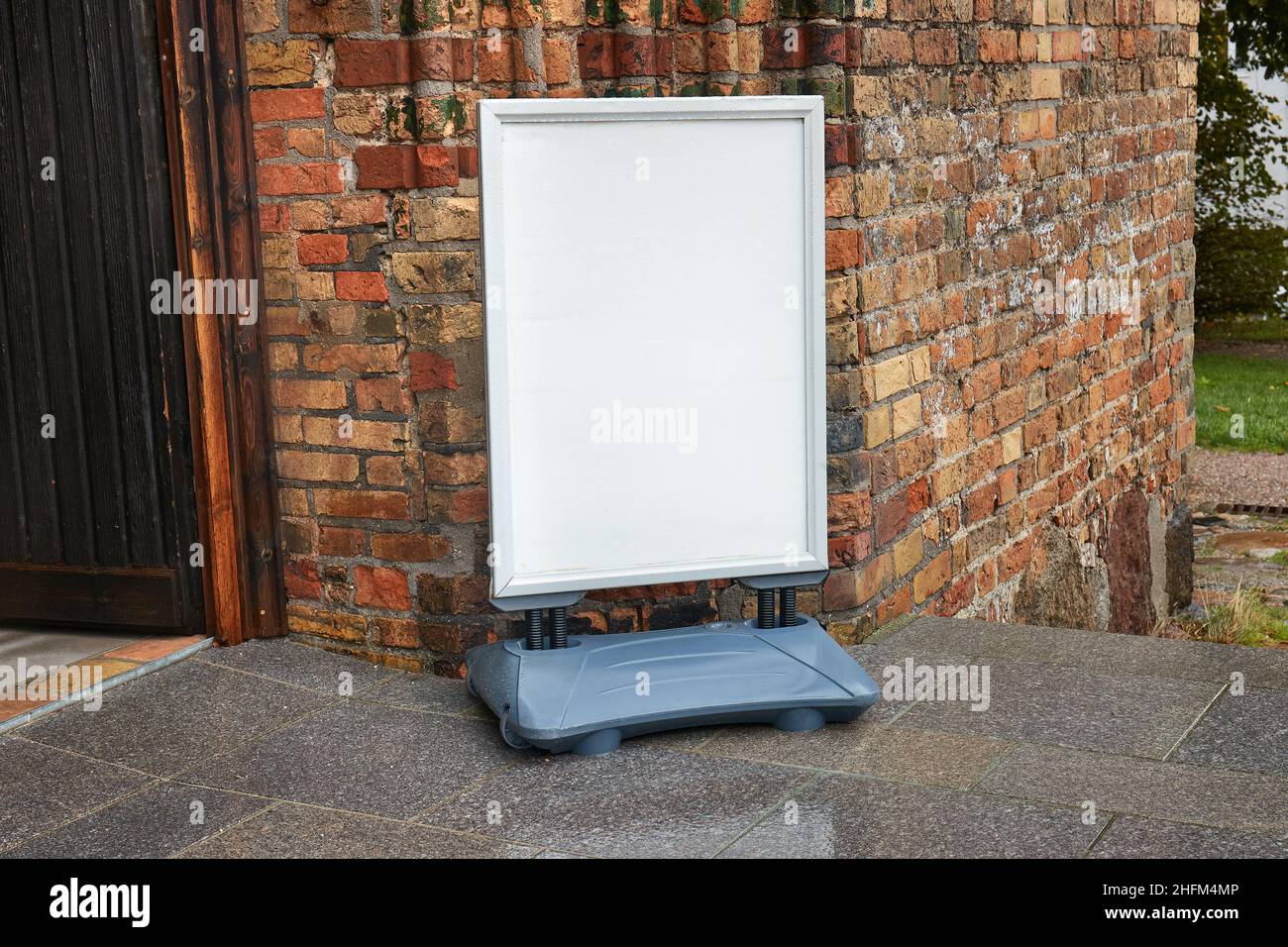 White Sign Board At Old Brick Building Entrance Stock Photo Alamy