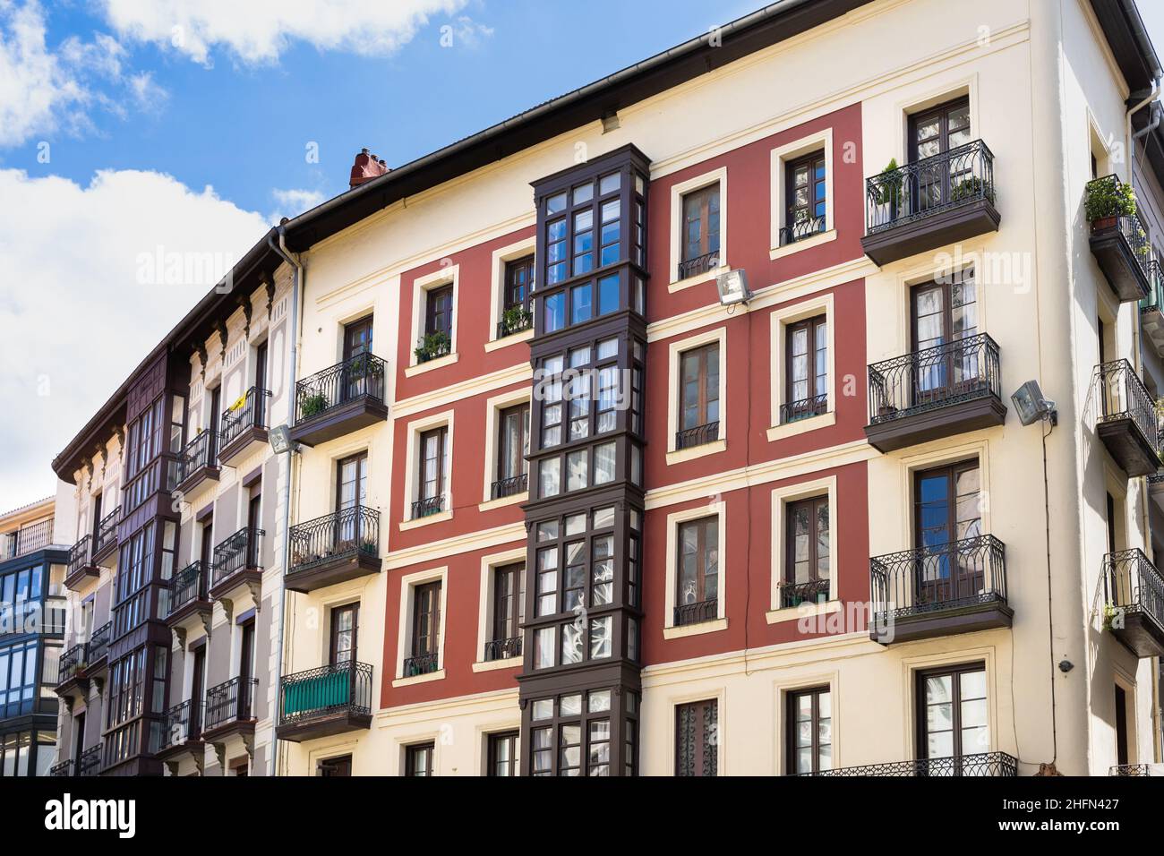 Facade of old buildings in Bilbao old town street. Residential houses ...