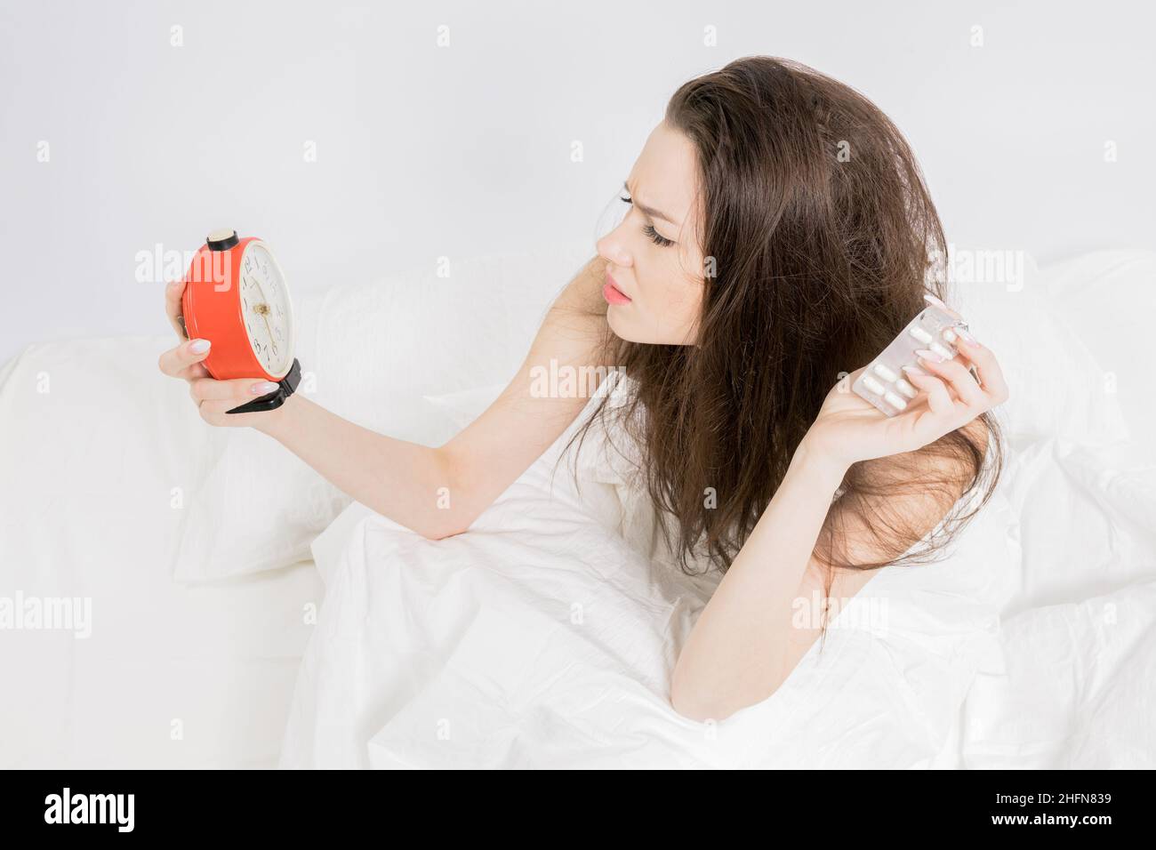 The woman is annoyed. I wake up from the alarm clock. Not getting