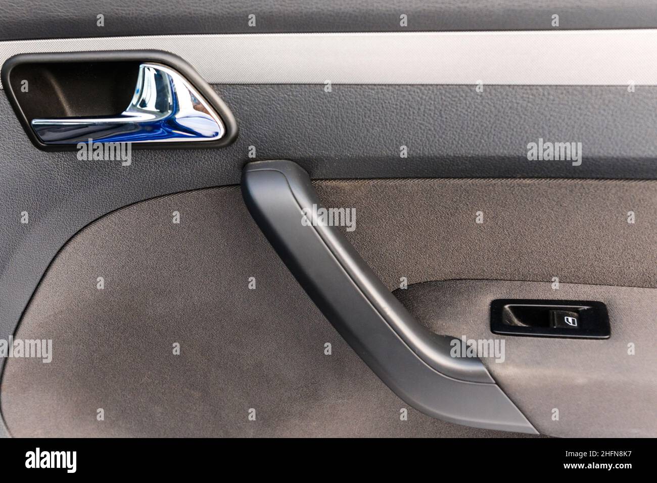 Inside the passenger door of the car with the new window lifter. Car