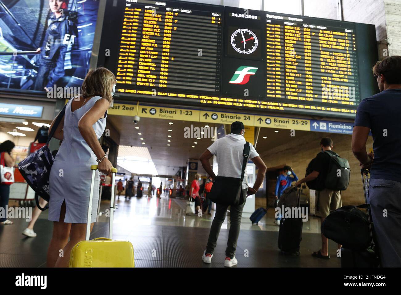 Cecilia Fabiano/LaPresse August 24 , 2020 Amatrice (Italy) News: Travelers in Termini Station In the pic : travelers checking train&#x2019;s timetable Stock Photo