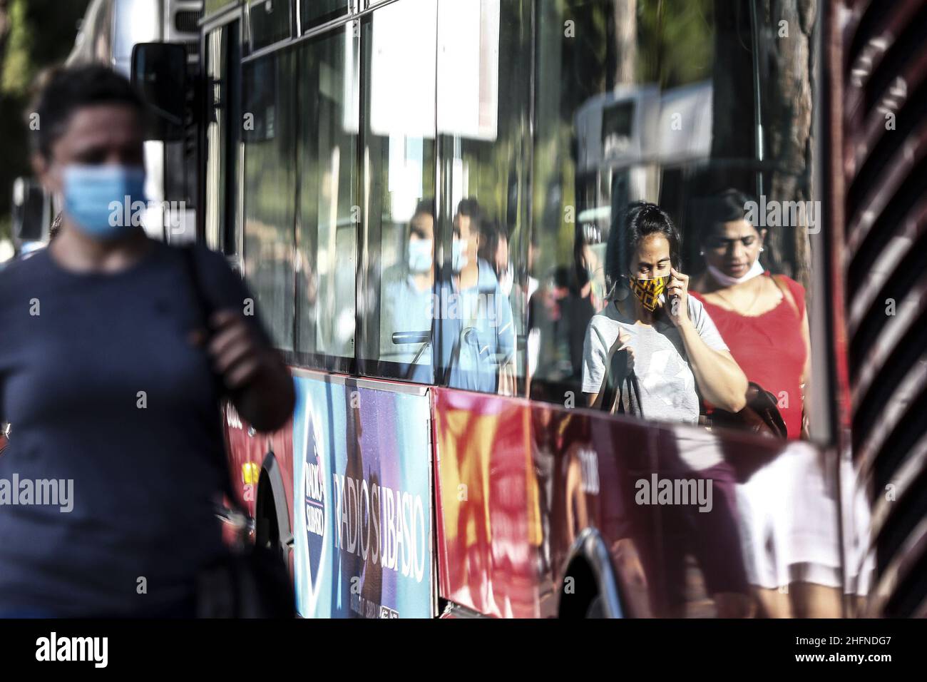 Cecilia Fabiano/LaPresse August 24 , 2020 Amatrice (Italy) News: Passengers and drivers with facial safety mask on Buses In the pic : buses on central station square Stock Photo