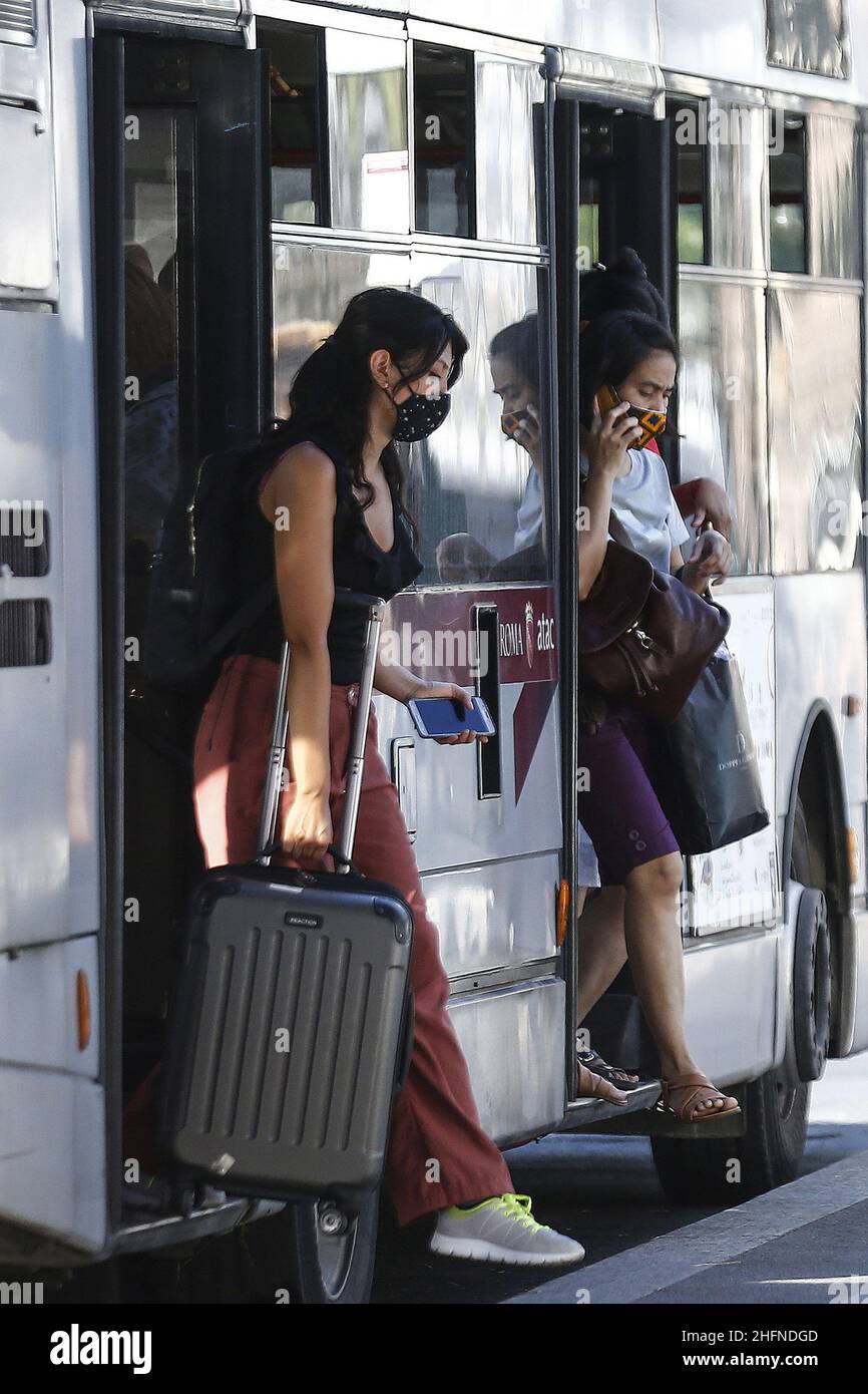 Cecilia Fabiano/LaPresse August 24 , 2020 Amatrice (Italy) News: Passengers and drivers with facial safety mask on Buses In the pic : buses on central station square Stock Photo