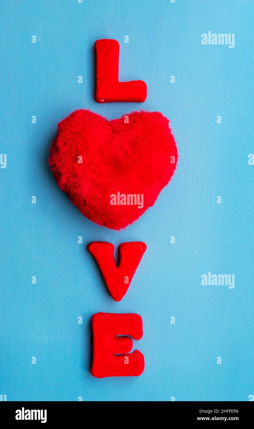 The word Love is made up of red letters on a blue background. Stock Photo