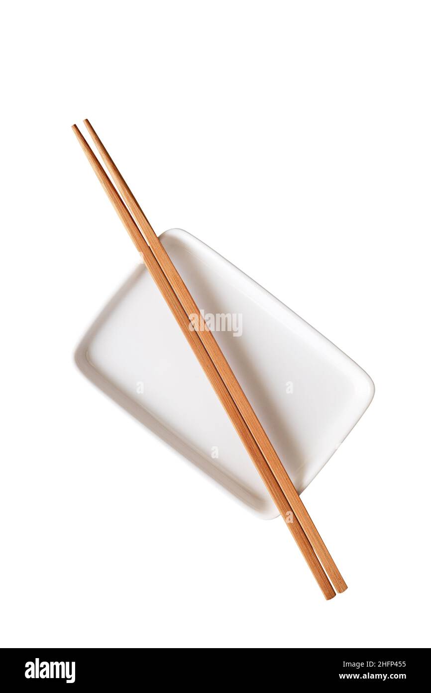 Empty ceramic rectangular plate with chopsticks isolated on white background Stock Photo