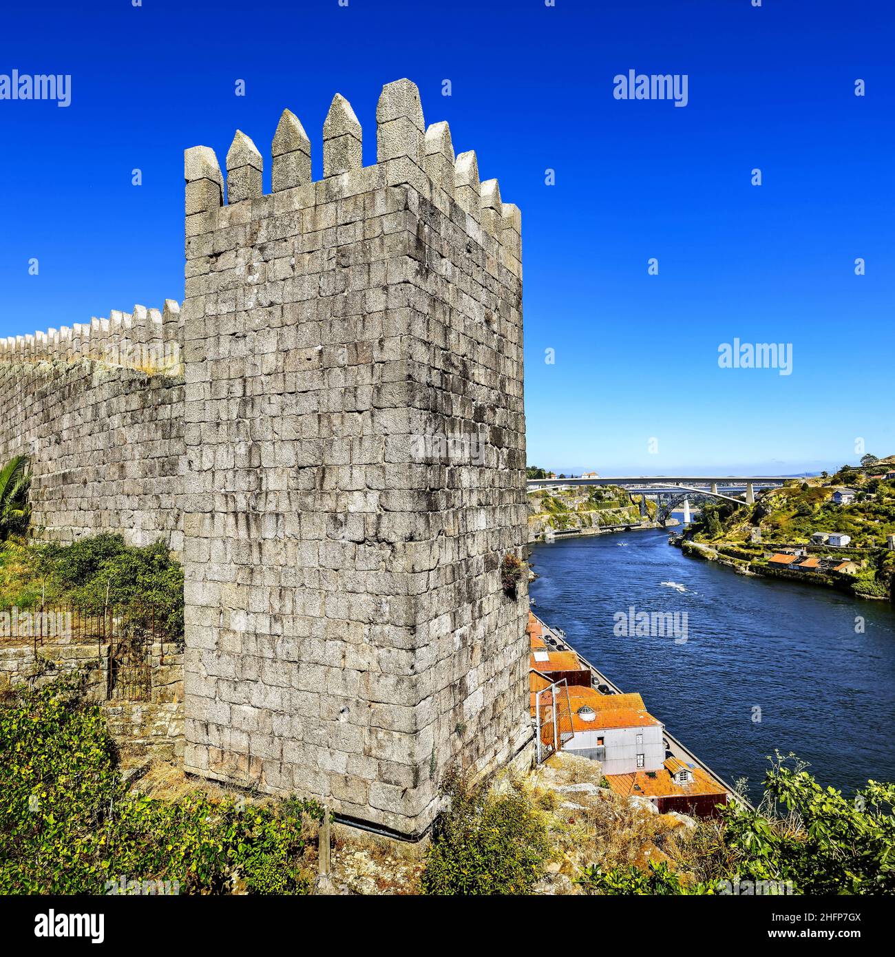 Portugal. Porto. Square Tower of Muralha Fernandina, the Bridges of the Infanta, Maria Pia and Sao Joao over the Douro Stock Photo
