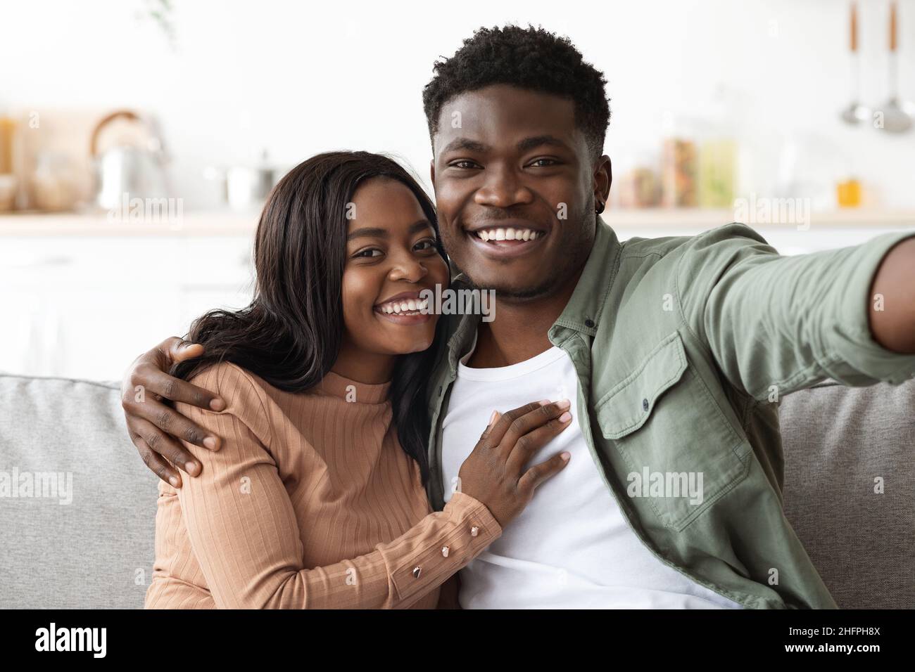 Cheerful african american man and woman taking photo together Stock Photo
