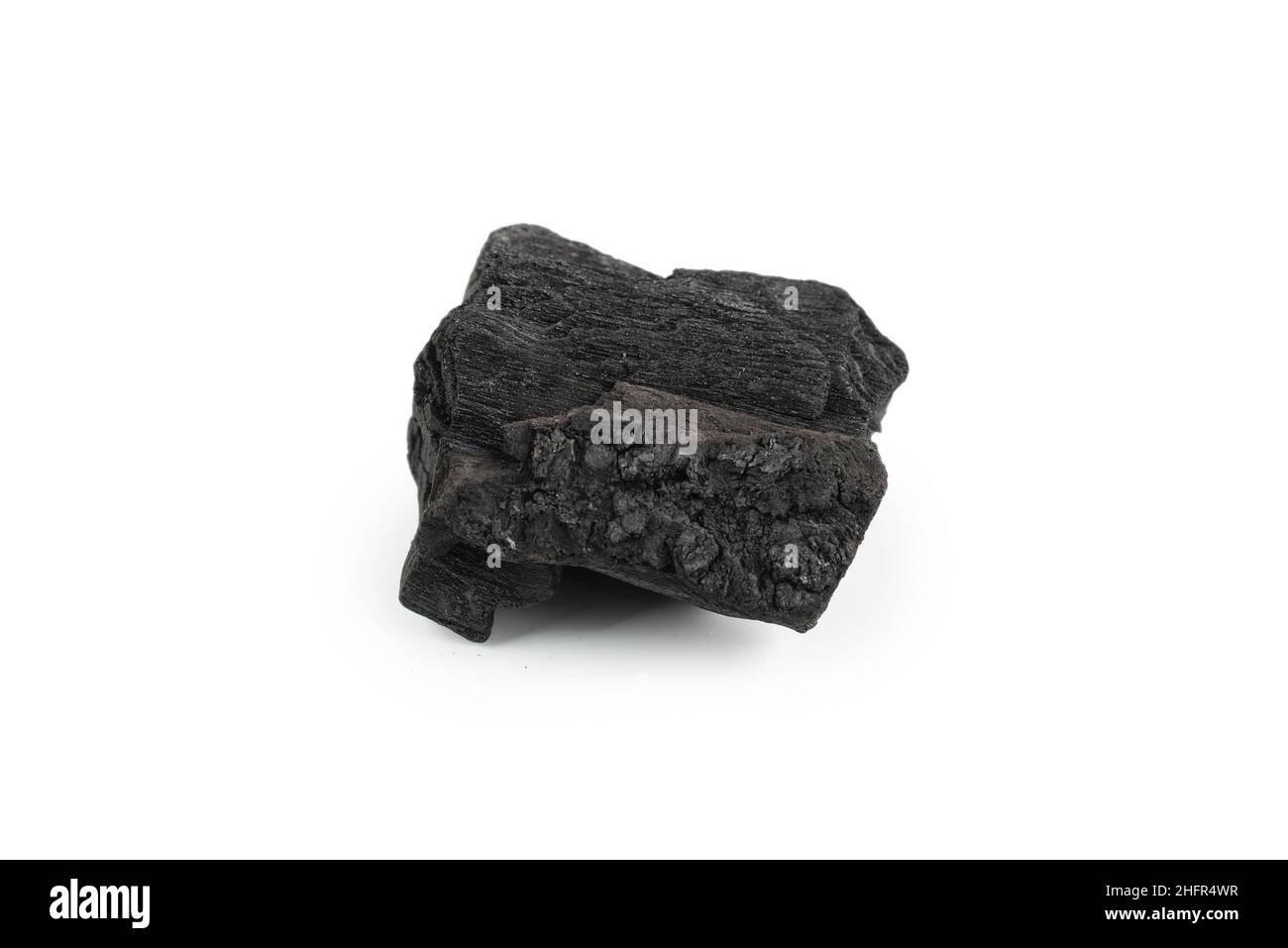 Black oak coal isolated on a white background. Stock Photo