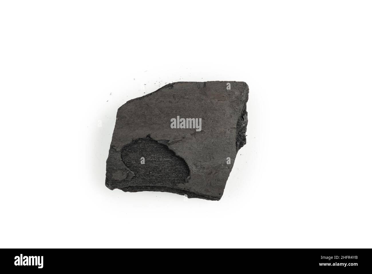 Black oak coal isolated on a white background. Stock Photo
