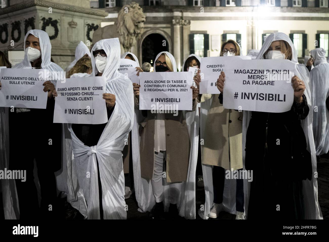 Shop owners masked as ghots seen in the square with placards. Shop Owners staged a protest to “give voice to firms” in Piazza dei Martiri in Naples. The protest was organised by Confcommercio Campania to denounce the economic losses deriving from the lockdown and curfew. Valeria Ferraro/LaPresse Stock Photo