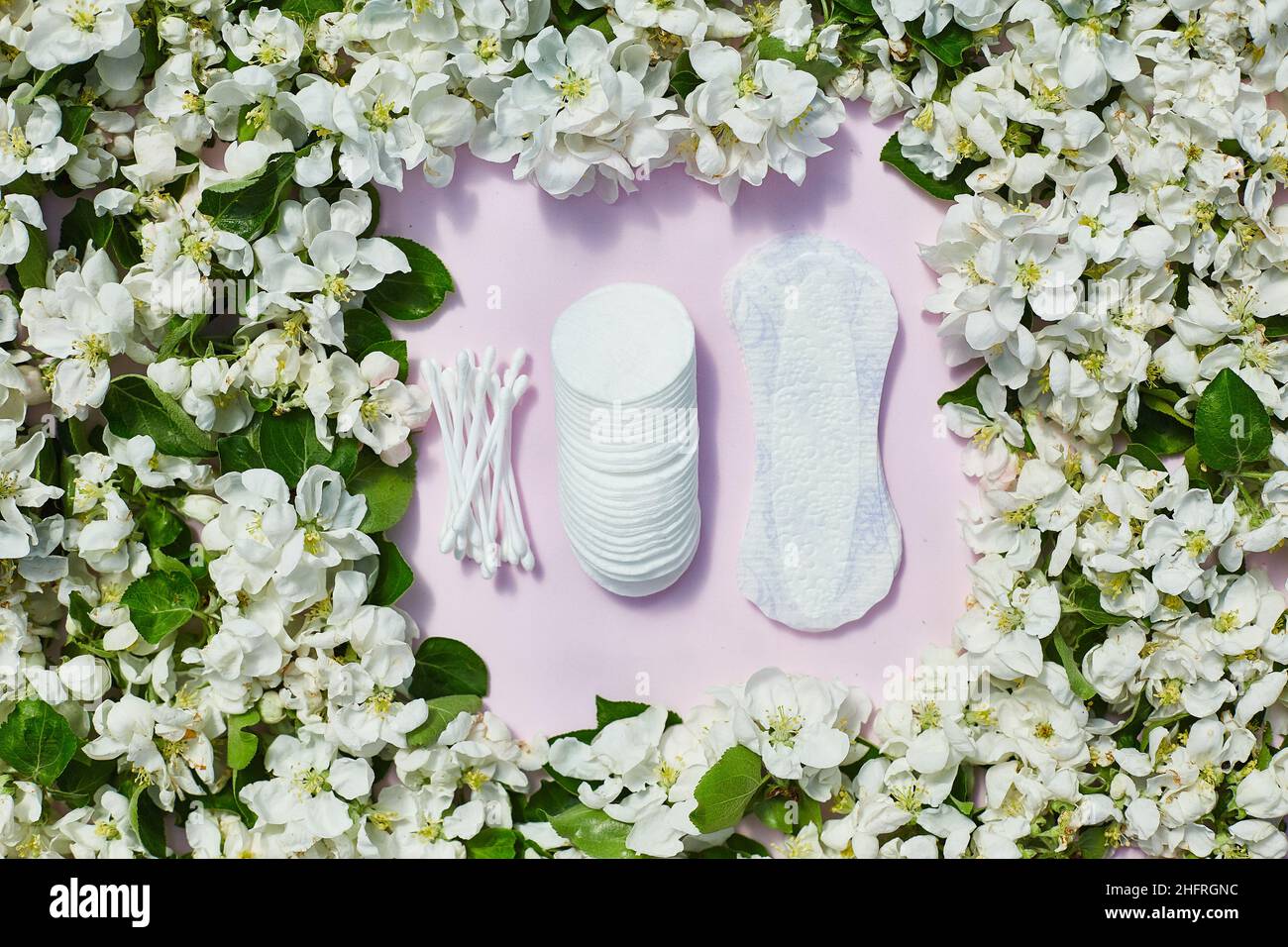 women intimate hygiene products sanitary pads and tampons on pink