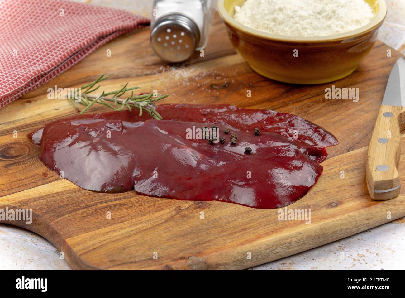 raw veal liver on a wooden board Stock Photo Alamy