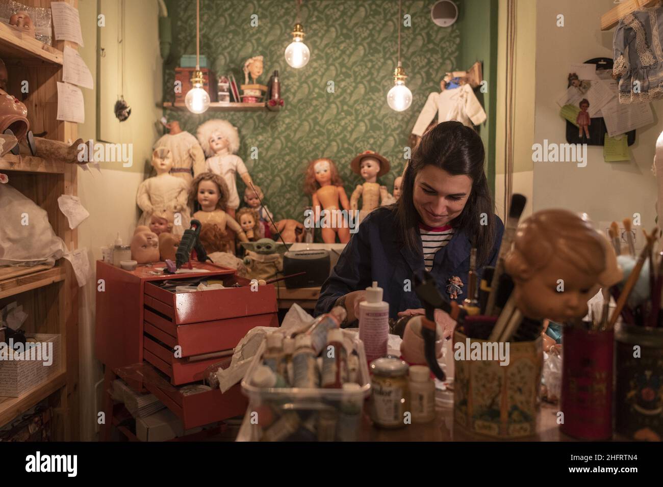 LaPresse/Marco Alpozzi December 10, 2020 Torino (Italy) News Greta Canalis (31 years old), restorer, is the &quot;doctor of dolls&quot;. In a shop in the center of Turin he restores and brings back to life old dolls and toys, many found during the months of lockdown in the attics. Stock Photo