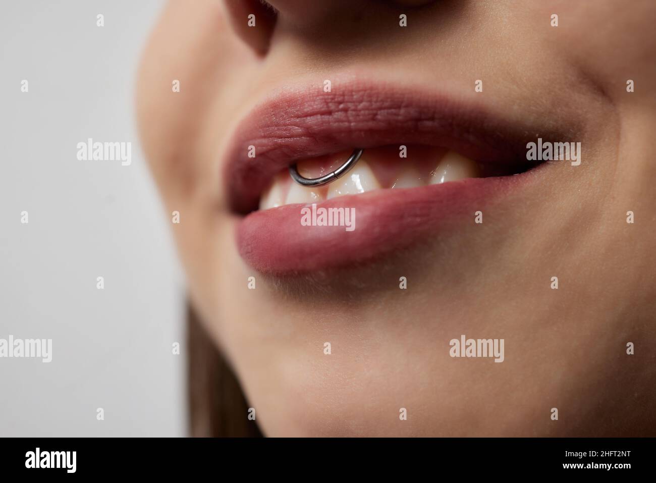 smile or frenulum piercing under the upper lip Stock Photo Alamy
