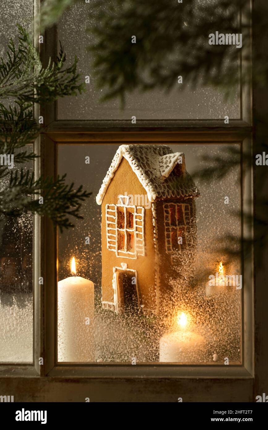 gingerbread house with candle view through the window Stock Photo Alamy