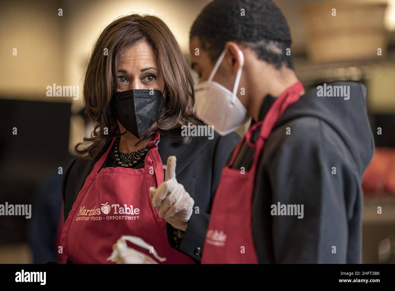 Washington, United States. 17th Jan, 2022. United States Vice President Kamala Harris helps bag produce with volunteer Brian Williams, 15, as she participates in a community service event at Martha's Kitchen in Washington, DC on Monday, January 17, 2022. Photo by Ken Cedeno/UPI Credit: UPI/Alamy Live News Stock Photo