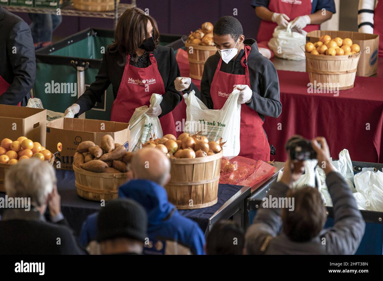 Washington, United States. 17th Jan, 2022. United States Vice President Kamala Harris helps bag produce with volunteer Brian Williams, 15, as she participates in a community service event at Martha's Kitchen in Washington, DC on Monday, January 17, 2022. Photo by Ken Cedeno/UPI Credit: UPI/Alamy Live News Stock Photo