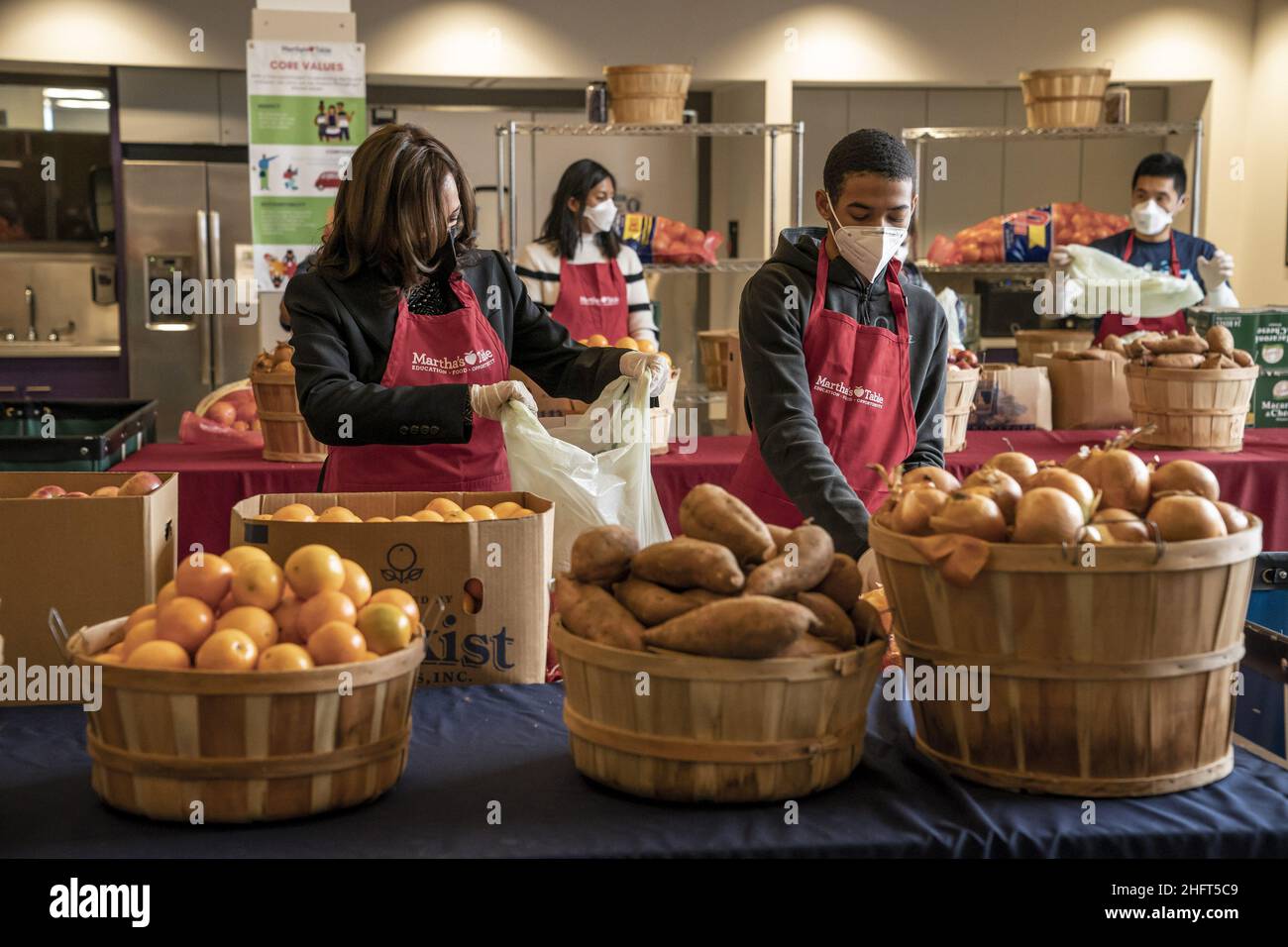 Washington, United States. 17th Jan, 2022. United States Vice President Kamala Harris helps bag produce with volunteer Brian Williams, 15, as she participates in a community service event at Martha's Kitchen in Washington, DC on Monday, January 17, 2022. Photo by Ken Cedeno/UPI Credit: UPI/Alamy Live News Stock Photo