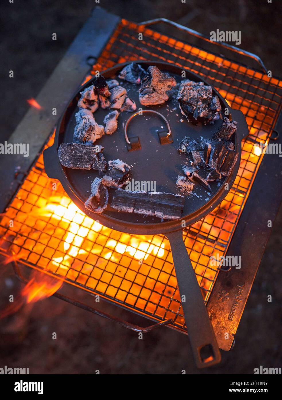 A cast iron cooking over an open fire, dutch oven style Stock Photo Alamy