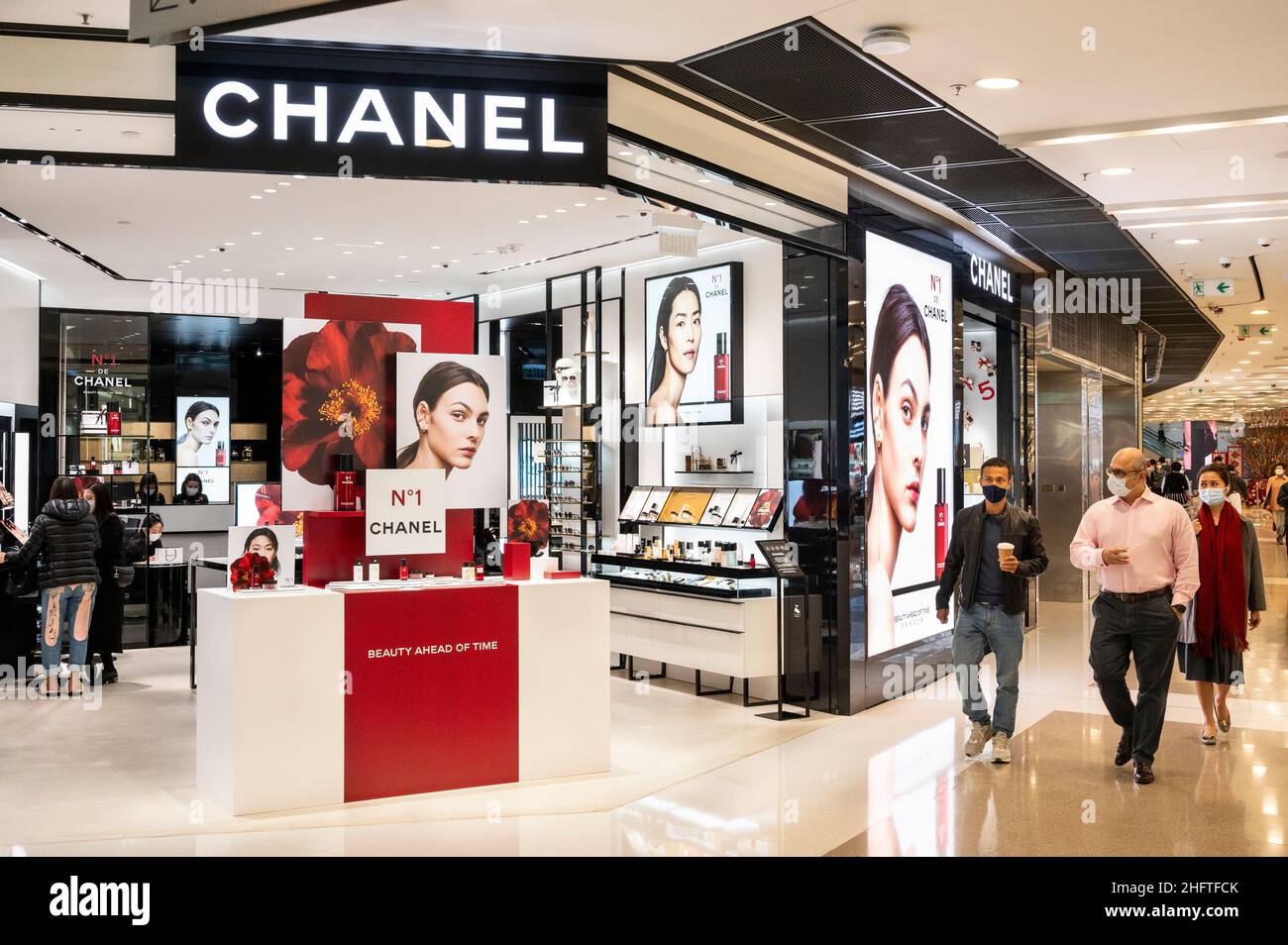 Shoppers walk past the French multinational Chanel clothing and beauty  products brand store in Hong Kong. (Photo by Budrul Chukrut / SOPA Images/Sipa  USA Stock Photo - Alamy