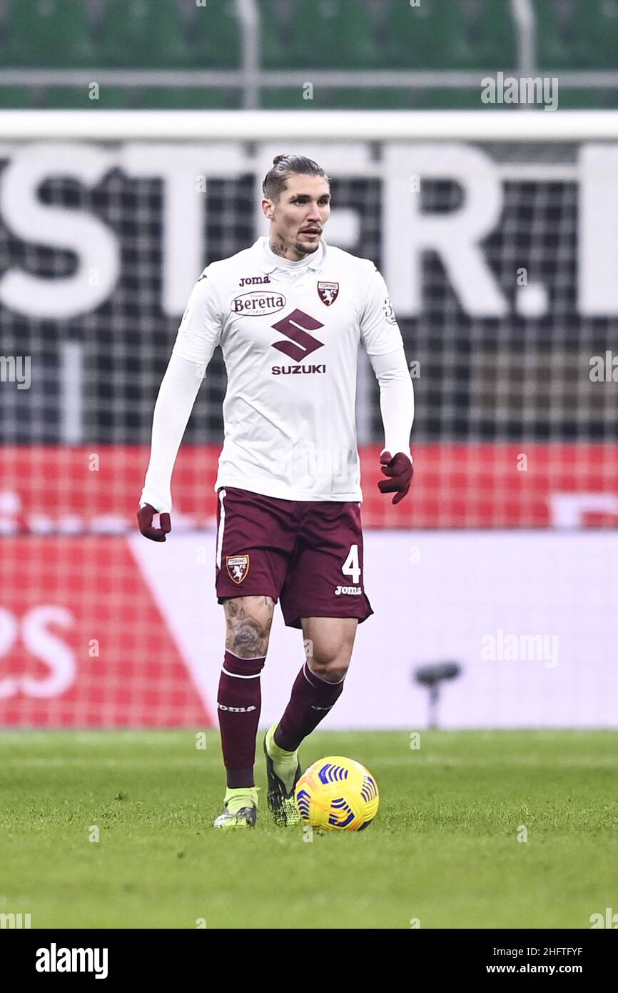 Santa Cristina Gherdeina, Italy. 24 July 2021. Lyanco Vojnovic (R) of Torino  FC competes for the ball with Emanuele Bocchio of SSC Brixen during the  pre-season friendly football match between Torino FC
